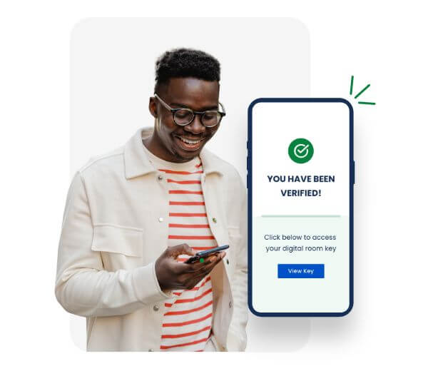 Man smiles at phone notification that he has been verified